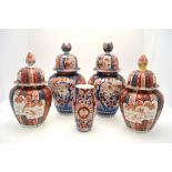 Two pairs of Japanese Imari vases, each vase with domed cover, 30 & 37 cm h.