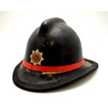 A post-war Hampshire Fire Service (Winchester 329) fireman's helmet with laminate shell and leather