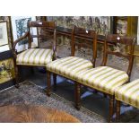 A set of six 19th century mahogany framed dining chairs with overstuffed seats comprising a pair of