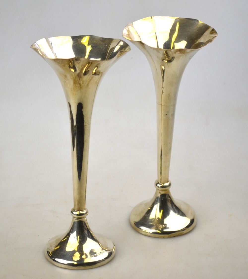 A pair of Edwardian silver trumpet-shaped vase-flutes on weighted bases, S. Blackensee & Sons Ltd.