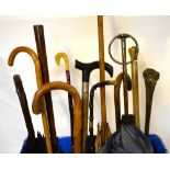 Assorted vintage umbrellas and parasols to/w three walking sticks,