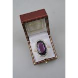 A large oval amethyst and diamond cocktail ring, yellow and white metal set, stamped 18ct, 3.