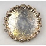 A William IV silver letter salver with shell and scroll rim, engraved decoration and shell feet, A.