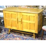 An early 1950s Ercol beech and elm sideboard, black label,