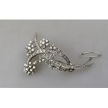 A 1950s style diamond-set double crescent and spray brooch set overall with mostly eight-cut