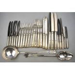 A set of six dessert forks with silver tines and loaded thread and shell handles,