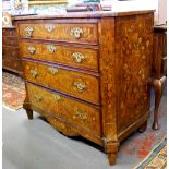An 18th century Dutch floral marquetry inlaid chest of four long graduated drawers flanked by