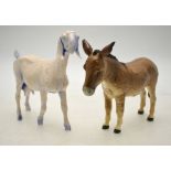 A Beswick model of a donkey to/w a studio pottery model of a nanny goat,