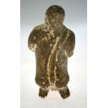 An antiquity (probably) North African carved stone figure of a kneeling baboon, holding an object,