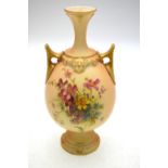 Royal Worcester blush ground twin handle vase, shape 2440, decorated with sprays of wild flowers,