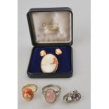 A lot comprising a shell cameo and earring suite to/w a shell cameo ring featuring storks,