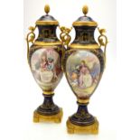 A pair of ormolu-mounted blue vases and covers,