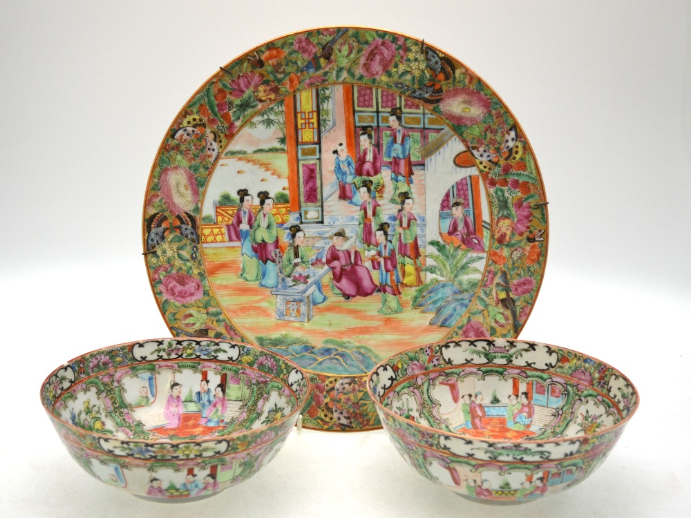 A Canton famille rose dish decorated with Manchu/Chinese figures in a narrative scene, 34.5 cm diam.