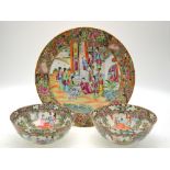 A Canton famille rose dish decorated with Manchu/Chinese figures in a narrative scene, 34.5 cm diam.