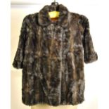 A child's vintage light brown moleskin fur coat Condition Report Worn condition,