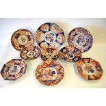 Nine various Japanese Imari dishes, all decorated with typical underglaze blue and floral designs,