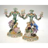 A pair of continental porcelain twin branch candelabra,