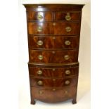 A Georgian style diminutive mahogany bowfront chest on chest of two short over six long graduated