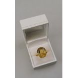 An oval citrine ring,