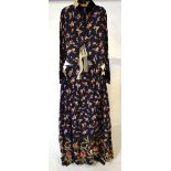 An Edwardian dark blue sateen cotton boned jacket and pleated skirt printed with apple blossom,