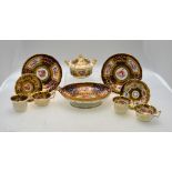 A rare Ridgway oval footed dish and two matching circular stands painted with floral reserves on a