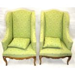 A good pair of 19th century walnut framed serpentine wingback armchairs upholstered in contemporary