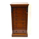 A Victorian mahogany Wellington chest of seven graduated drawers each with original turned pulls,