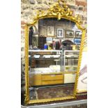 A 19th century giltwood framed overmantle mirror with ribbon bow arched pediment,