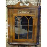 A George III brass inlaid mahogany hanging corner cabinet,