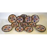 Nine Victorian Crown Derby dinner plates decorated in the Imari style, pattern 524, 26.5 cm diam.