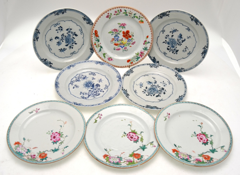 Four Chinese famille rose plates, 22.7 cm diam. and four Chinese blue and white plates, 23.