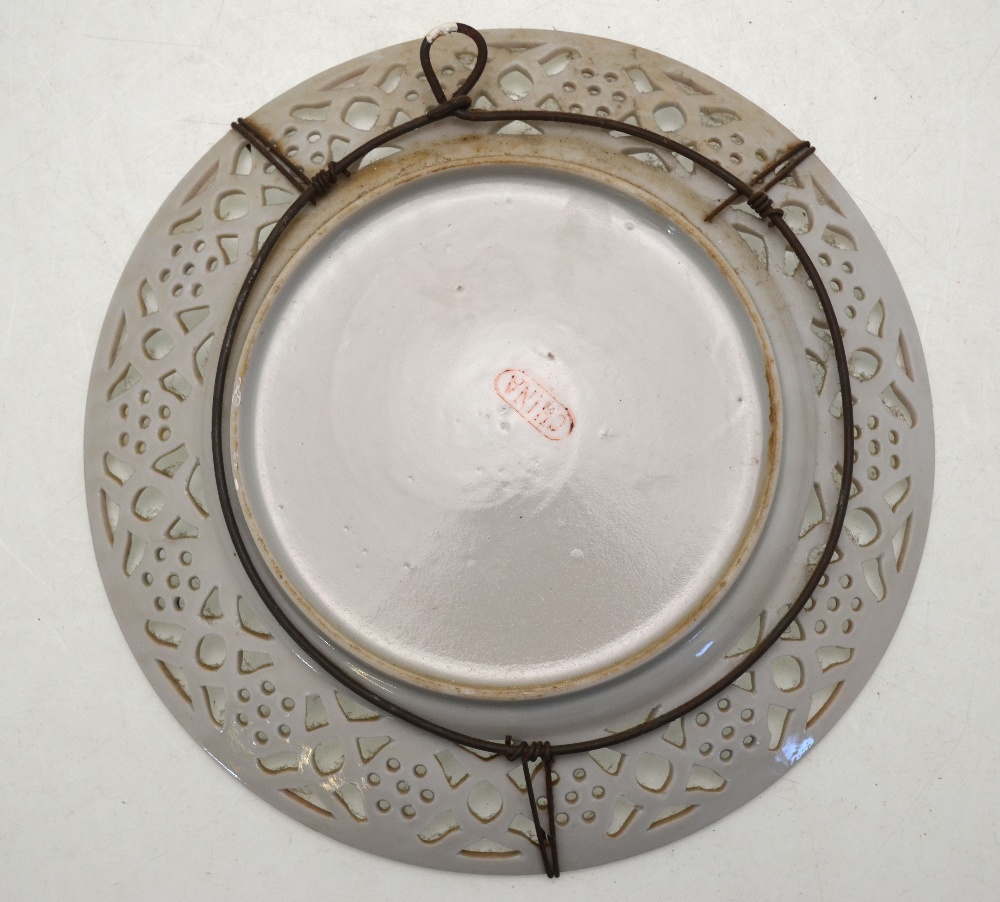 A Canton famille rose dish with reticulated rim, the base with China mark, Qing dynasty, 21. - Image 2 of 4