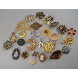 A collection of vintage brooches etc including shell and basalt cameos,