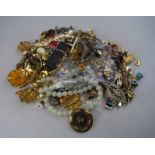 A mixed lot of vintage and later costume jewellery including beads, earrings,
