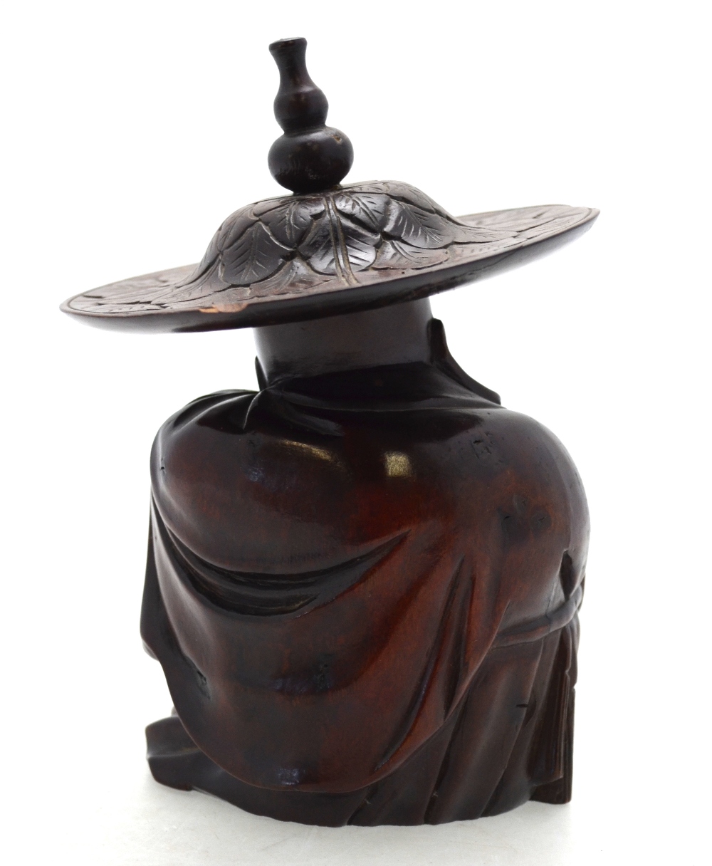A Chinese hardwood carving of a seated sage wrapped in a cloak and wearing a wide brimmed hat, - Image 3 of 6