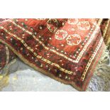 Two old Afghan Turkoman design rugs, brown-red ground,