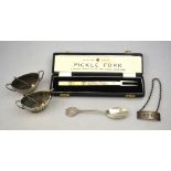 A cased silver pickle fork ('A Faithful Replica of the First English Silver Fork'),