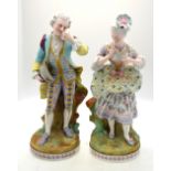 A pair of continental bisque figures of a lady and gentleman resting on a tree stump raised on a