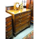 An 18th century mahogany caddy top chest of four long graduated drawers beneath a full width brush