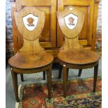 A pair of 19th century mahogany hall chairs,