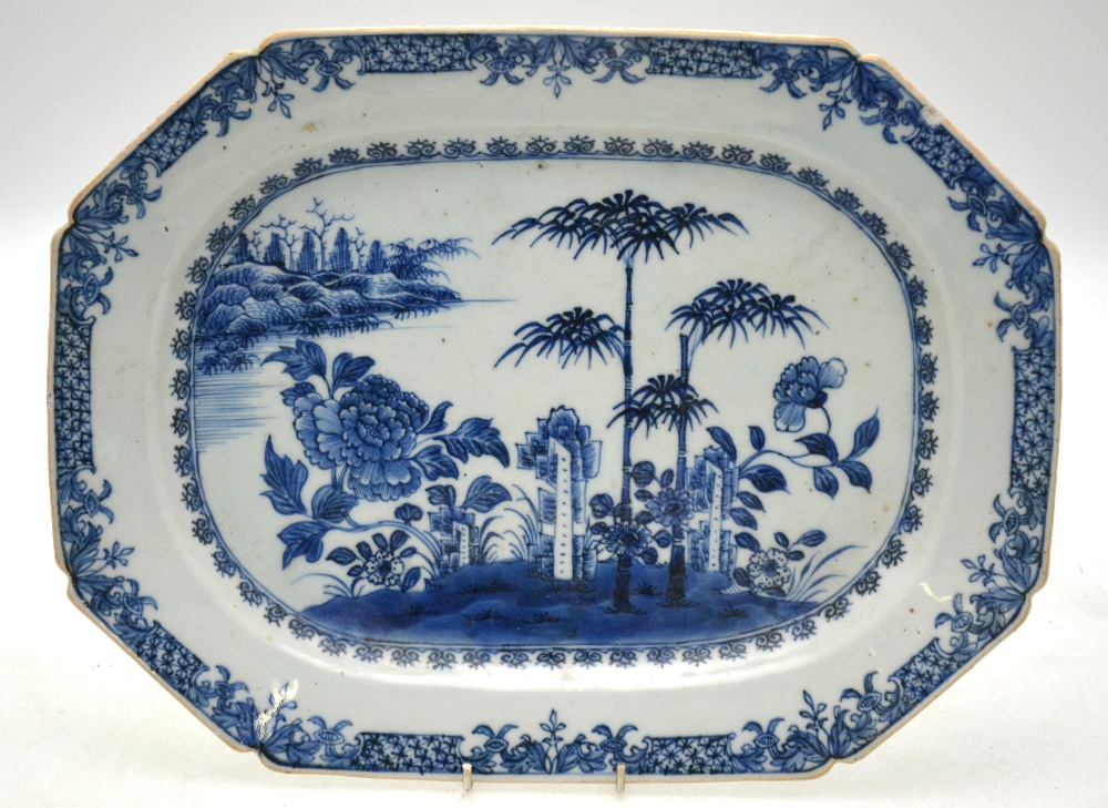 A Chinese blue and white chamfered rectangular meat dish decorated with rockwork,