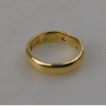 A 22ct yellow gold D -shaped wedding band engraved inside with initials and date,