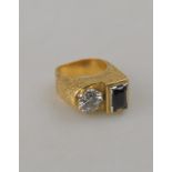 A 1960s textured ring set with synthetic sapphire and synthetic white stone, stamped 18ct,