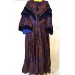 A Victorian brown silk brocade dress with vibrant blue floral sprays,