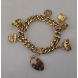 A rose-gold hollow-linked curb bracelet with 9ct padlock,