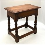 An antique oak joint stool