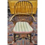 A 19th century elm and fruitwood stick back Windsor elbow chair Condition Report