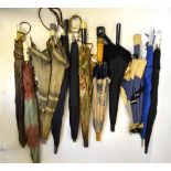 Seven assorted 1930s ladies' umbrellas with decorative grips, to/w a Victorian black silk parasol,