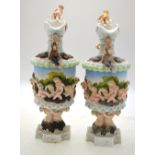 A continental pair of porcelain wine flagons, possibly Sitzendorf,