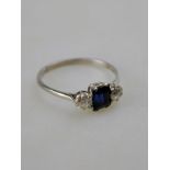 A three stone diamond and sapphire ring, white metal claw set,